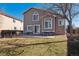 Back of house view features a concrete patio perfect for outdoor relaxation at 9069 Renoir Dr, Littleton, CO 80126