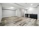 Basement with plank flooring and kitchenette space with cabinets at 10320 W 35Th Ave, Wheat Ridge, CO 80033