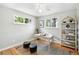 Bright bedroom featuring two windows, hardwood floors, and modern decor at 10320 W 35Th Ave, Wheat Ridge, CO 80033