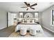 Comfortable bedroom with decorative wall shelves and plush decor at 10320 W 35Th Ave, Wheat Ridge, CO 80033