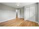 Spacious bedroom with closet, light gray walls, wood flooring, and ceiling fan at 10320 W 35Th Ave, Wheat Ridge, CO 80033