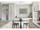 Eat-in kitchen area features modern art and a stylish table perfect for casual dining at 10320 W 35Th Ave, Wheat Ridge, CO 80033