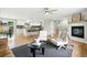 Open-concept living room and kitchen with hardwood floors and lots of natural light at 10320 W 35Th Ave, Wheat Ridge, CO 80033