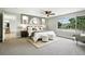 Spacious main bedroom with stylish decor, a large window, and neutral colors at 10320 W 35Th Ave, Wheat Ridge, CO 80033