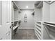 Walk-in closet featuring custom shelving and storage for optimal organization of wardrobes at 10320 W 35Th Ave, Wheat Ridge, CO 80033