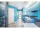 Bright turquoise bathroom with double vanity, a walk-in shower and separate soaking tub at 6147 N Flanders St, Aurora, CO 80019