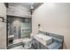 Contemporary bathroom featuring sleek fixtures, a modern shower, and stylish tiling at 6147 N Flanders St, Aurora, CO 80019