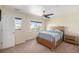 Bright bedroom with a ceiling fan and window offering pleasant neighborhood views at 6147 N Flanders St, Aurora, CO 80019