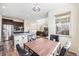 Open-concept dining area connects to the kitchen and living room with lots of natural light at 6147 N Flanders St, Aurora, CO 80019