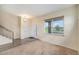 Welcoming entryway featuring warm tones, multiple windows, and a decorative chandelier at 6147 N Flanders St, Aurora, CO 80019