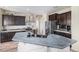Modern kitchen features a large island, stainless steel appliances, and designer backsplash at 6147 N Flanders St, Aurora, CO 80019