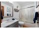 Clean bathroom with a shower-tub combo, new vanity, and updated fixtures at 16234 E Belleview Dr, Centennial, CO 80015