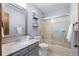Well lit bathroom featuring a shower-tub and a gray vanity at 16234 E Belleview Dr, Centennial, CO 80015
