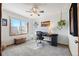 Bright bedroom with ceiling fan, workstation, and natural light at 16234 E Belleview Dr, Centennial, CO 80015