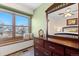 Well-lit bedroom with a ceiling fan, a dresser, and a bright window at 16234 E Belleview Dr, Centennial, CO 80015