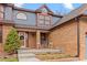 Charming front porch with seating area and decorative wreath, perfect for welcoming guests at 16234 E Belleview Dr, Centennial, CO 80015