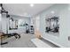 Basement gym featuring weight training equipment, mats and mirrors at 16234 E Belleview Dr, Centennial, CO 80015