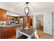Bright kitchen featuring stainless steel appliances, granite countertops, and adjacent dining area perfect for modern living at 16234 E Belleview Dr, Centennial, CO 80015