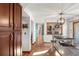 Open concept kitchen featuring warm wood cabinets, and seamlessly connecting to the dining area and other living spaces at 16234 E Belleview Dr, Centennial, CO 80015