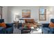 Stylish living room showcasing comfortable seating, modern decor, and ample natural light for a bright ambiance at 16234 E Belleview Dr, Centennial, CO 80015