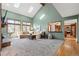 Spacious living room with high ceilings, a fireplace, and a large sectional sofa at 16234 E Belleview Dr, Centennial, CO 80015