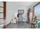 Bright home office features a modern desk setup with a large window at 16234 E Belleview Dr, Centennial, CO 80015