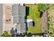 Aerial view of a property with well-maintained landscaping, a lush lawn, and a pergola at 6604 S Dahlia Cir, Centennial, CO 80121