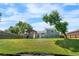 Spacious backyard featuring a covered pergola, green lawn, and privacy fence at 6604 S Dahlia Cir, Centennial, CO 80121
