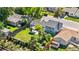 Aerial view of a private backyard featuring a manicured lawn, shed, and pergola at 6604 S Dahlia Cir, Centennial, CO 80121