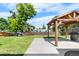 Backyard featuring a covered pergola with a concrete base at 6604 S Dahlia Cir, Centennial, CO 80121