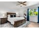 Cozy bedroom features a wooden bed frame, soft rug, and lots of natural light at 6604 S Dahlia Cir, Centennial, CO 80121