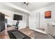 Finished basement bedroom showing access to a doorway and an arm chair at 6604 S Dahlia Cir, Centennial, CO 80121