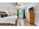 Bedroom with a rustic dresser, a full bed with soft linens, and lots of natural light at 6604 S Dahlia Cir, Centennial, CO 80121