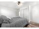 Bright room features a queen size bed with stylish gray and white decor and lots of closet space at 6604 S Dahlia Cir, Centennial, CO 80121