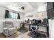 Finished basement bedroom with a large desk for multiple computer setup at 6604 S Dahlia Cir, Centennial, CO 80121