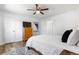 Bedroom with a rustic dresser, a full bed with soft linens, and lots of closet space at 6604 S Dahlia Cir, Centennial, CO 80121