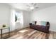 This flexible bedroom features a comfortable couch and great natural light at 6604 S Dahlia Cir, Centennial, CO 80121