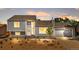 Charming exterior view of a well-kept home at dusk with fresh landscaping and warm, inviting lighting at 6604 S Dahlia Cir, Centennial, CO 80121