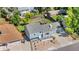 Well-maintained blue home boasts fresh landscaping, a lush lawn, and a private backyard at 6604 S Dahlia Cir, Centennial, CO 80121