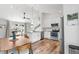 Bright kitchen features white cabinets, stainless steel appliances, and modern finishes with space for dining at 6604 S Dahlia Cir, Centennial, CO 80121