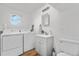 Bright laundry room with a washing machine, dryer, and a sink at 6604 S Dahlia Cir, Centennial, CO 80121