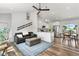 Open-concept living space with a vaulted ceiling, and modern furnishings at 6604 S Dahlia Cir, Centennial, CO 80121