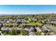Overhead view of a residential community with mature trees and well-kept lawns at 2002 E 102Nd Cir, Thornton, CO 80229