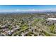 Expansive aerial view of a neighborhood with parks, trails, and a scenic lake at 2002 E 102Nd Cir, Thornton, CO 80229