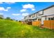 The backyard has a grassy lawn and wooden fence offering privacy and space for recreation at 2002 E 102Nd Cir, Thornton, CO 80229
