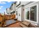 Charming patio with wooden deck, rug, and easy access to the house via a sliding glass door at 2002 E 102Nd Cir, Thornton, CO 80229