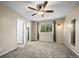 Spacious bedroom featuring carpet, ceiling fan, and a window with natural light at 2002 E 102Nd Cir, Thornton, CO 80229