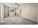 Bright bedroom featuring neutral walls, carpet, ceiling fan, and a window with natural light at 2002 E 102Nd Cir, Thornton, CO 80229
