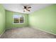 Bright bedroom with a large window and neutral carpeted floors at 2002 E 102Nd Cir, Thornton, CO 80229