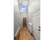 Inviting entryway with hardwood floors, a high ceiling, and a decorative light fixture at 2002 E 102Nd Cir, Thornton, CO 80229